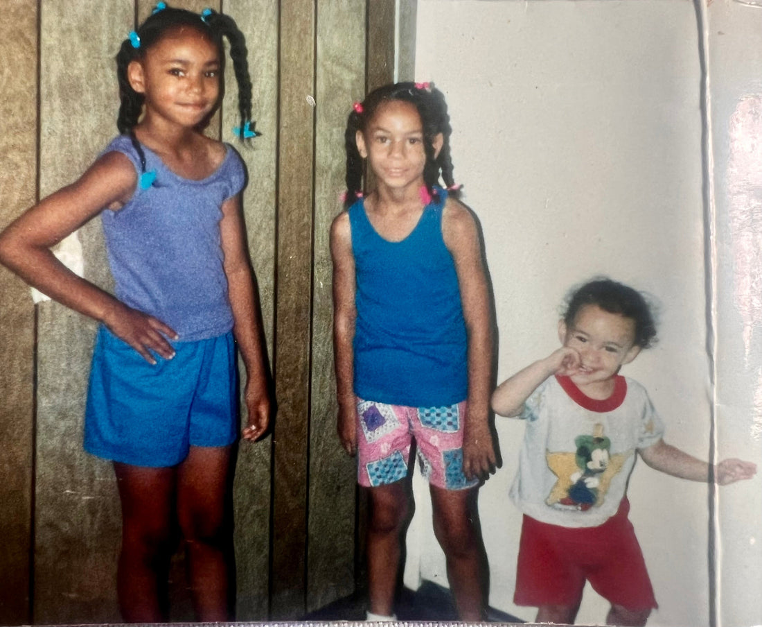 Left to right are author of The Sandwich Way, Jalaila Hardy and her older and younger sisters. Javette age 7 in blue shorts, Jalaila Hardy at five years old in the middle and one year old Lasasha on the right in red.