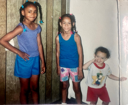 Left to right are author of The Sandwich Way, Jalaila Hardy and her older and younger sisters. Javette age 7 in blue shorts, Jalaila Hardy at five years old in the middle and one year old Lasasha on the right in red.